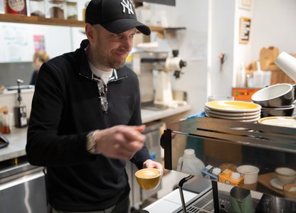 Ben serving at Cafe