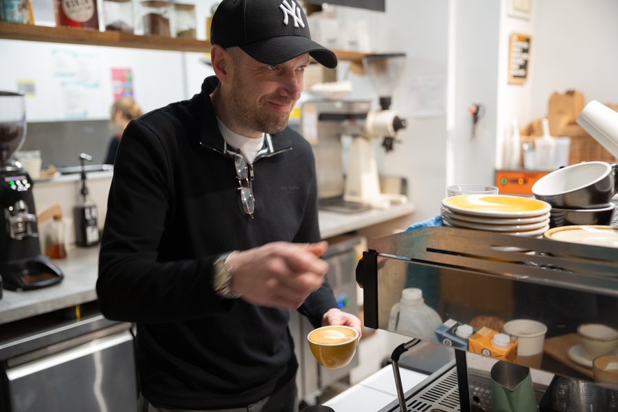 Ben serving at Cafe
